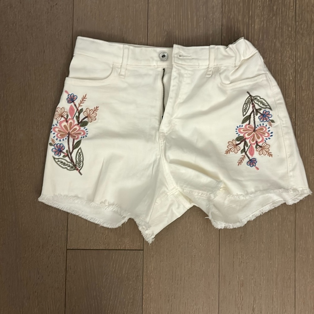 White shorts with sequin floral detail